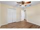 Well-lit bedroom with wood-look floors and ample closet space at 6515 Clair Shore Dr, Apollo Beach, FL 33572