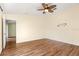 Bright bedroom with wood-look floors and ceiling fan at 6515 Clair Shore Dr, Apollo Beach, FL 33572