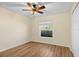 Spacious bedroom featuring wood-look floors and a ceiling fan at 6515 Clair Shore Dr, Apollo Beach, FL 33572