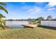Wooden dock overlooking a tranquil lake with lush greenery at 6515 Clair Shore Dr, Apollo Beach, FL 33572