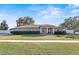 Single-story home with landscaped lawn at 6515 Clair Shore Dr, Apollo Beach, FL 33572