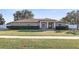 Single-story house with a landscaped lawn and neutral exterior at 6515 Clair Shore Dr, Apollo Beach, FL 33572