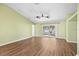 Spacious living area featuring a sliding glass door and wood-look floors at 6515 Clair Shore Dr, Apollo Beach, FL 33572