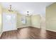 Bright and airy living room with laminate flooring and neutral walls at 6515 Clair Shore Dr, Apollo Beach, FL 33572