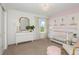 Peaceful Bedroom with a crib, dresser, and llama art at 6659 Depue Dr, Wesley Chapel, FL 33545