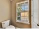 Clean bathroom with toilet and window at 7001 Interbay Blvd # 197, Tampa, FL 33616