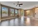 Living room featuring hardwood floors, neutral walls, and sliding glass doors to backyard at 7001 Interbay Blvd # 197, Tampa, FL 33616