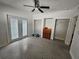 Bright bedroom featuring double closets and terrazzo floors at 8300 Boca Ciega Dr, St Pete Beach, FL 33706