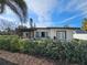 House exterior featuring mid-century modern design at 8300 Boca Ciega Dr, St Pete Beach, FL 33706