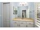 Bathroom featuring a large mirror, vanity with drawers, and a closet at 9244 Rhea Dr, Odessa, FL 33556