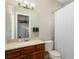 Clean bathroom with wood vanity and shower/tub combo at 9244 Rhea Dr, Odessa, FL 33556