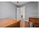 Spacious bedroom with hardwood floors and access to other rooms at 9244 Rhea Dr, Odessa, FL 33556