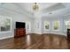 Spacious bedroom with hardwood floors and large windows at 9244 Rhea Dr, Odessa, FL 33556