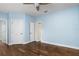 Spacious bedroom with hardwood floors and multiple entry points at 9244 Rhea Dr, Odessa, FL 33556