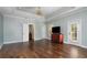 Bright bedroom featuring hardwood floors and multiple exits at 9244 Rhea Dr, Odessa, FL 33556