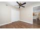 Bright bedroom with hardwood floors, ceiling fan, and a closet at 9244 Rhea Dr, Odessa, FL 33556