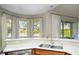 Kitchen with breakfast nook overlooking the backyard pool at 9244 Rhea Dr, Odessa, FL 33556