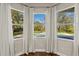 View from kitchen window shows a beautiful backyard pool at 9244 Rhea Dr, Odessa, FL 33556