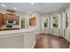 Eat-in kitchen with hardwood floors and custom cabinetry at 9244 Rhea Dr, Odessa, FL 33556