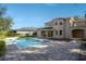 Expansive pool and spa with surrounding stone patio at 9244 Rhea Dr, Odessa, FL 33556