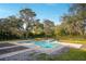 Inviting, rectangular pool with a spa, surrounded by lush greenery at 9244 Rhea Dr, Odessa, FL 33556