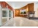 Spacious living room featuring a brick fireplace and wood wall accents at 9292 120Th Ln, Seminole, FL 33772