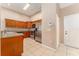 Kitchen with granite countertops, stainless steel appliances, and wood cabinets at 9406 Citrus Glen Pl, Tampa, FL 33618