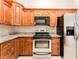Bright kitchen with granite countertops and stainless steel appliances at 9406 Citrus Glen Pl, Tampa, FL 33618