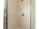 Clean shower with beige tile surround and a single shower head at 9406 Citrus Glen Pl, Tampa, FL 33618