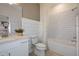 Clean bathroom with white subway tile, bathtub, and quartz countertop at 9813 Crescent Moon Dr, Riverview, FL 33578
