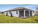 Home exterior showcasing a screened porch and landscaping at 9813 Crescent Moon Dr, Riverview, FL 33578