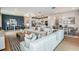 Open concept living area with sectional sofa and adjacent dining area at 9813 Crescent Moon Dr, Riverview, FL 33578