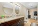 Bathroom with double vanity and granite countertop at 11201 Knotty Pine Dr, New Port Richey, FL 34654