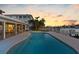 Enjoy waterfront sunset views from this relaxing pool and patio area at 11280 7Th E St, Treasure Island, FL 33706