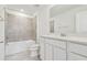 Bathroom with tub, toilet, and white vanity at 12213 Tranquil Waters Ter, Parrish, FL 34219
