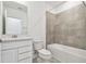 Bathroom with white vanity and tiled shower at 12213 Tranquil Waters Ter, Parrish, FL 34219
