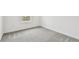 Bedroom with grey carpet and a window view at 12213 Tranquil Waters Ter, Parrish, FL 34219