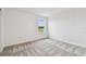 Spacious bedroom with grey carpet and window at 12213 Tranquil Waters Ter, Parrish, FL 34219