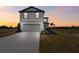 Two story house with driveway and landscaping at 12213 Tranquil Waters Ter, Parrish, FL 34219