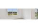 Bright living room with large window and view at 12213 Tranquil Waters Ter, Parrish, FL 34219