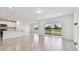 Open living area with sliding glass doors at 12213 Tranquil Waters Ter, Parrish, FL 34219