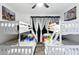 ' bedroom with a bunk bed and colorful bedding at 1271 Woodlawn St, Clearwater, FL 33756