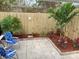 Small, private backyard with bamboo fence and tropical plants at 13708 Salem St, Madeira Beach, FL 33708