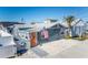 Charming beach cottage with orange door, American flag, and crab decor at 13708 Salem St, Madeira Beach, FL 33708