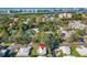 Aerial view showing home's location in a residential neighborhood near the water at 14198 89Th Ave, Seminole, FL 33776