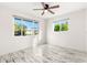 Bright bedroom with wood-look floors and large windows at 14198 89Th Ave, Seminole, FL 33776