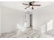 Spacious bedroom with double doors and wood-look floors at 14198 89Th Ave, Seminole, FL 33776