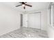 Well-lit bedroom with double doors and wood-look floors at 14198 89Th Ave, Seminole, FL 33776