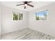 Well-lit bedroom with wood-look floors and windows at 14198 89Th Ave, Seminole, FL 33776