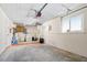Spacious garage with overhead door, ample storage, and window for natural light at 14198 89Th Ave, Seminole, FL 33776